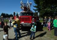 Crowd Looking at Red Truck